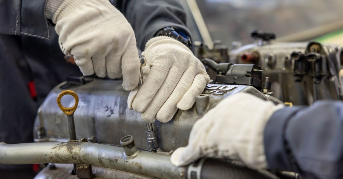 Industrial maintenance engineer inspecting bolted joints with efficient reusable lock nuts