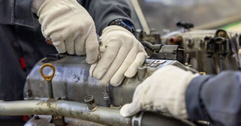 Industrial maintenance engineer inspecting bolted joints with efficient reusable lock nuts
